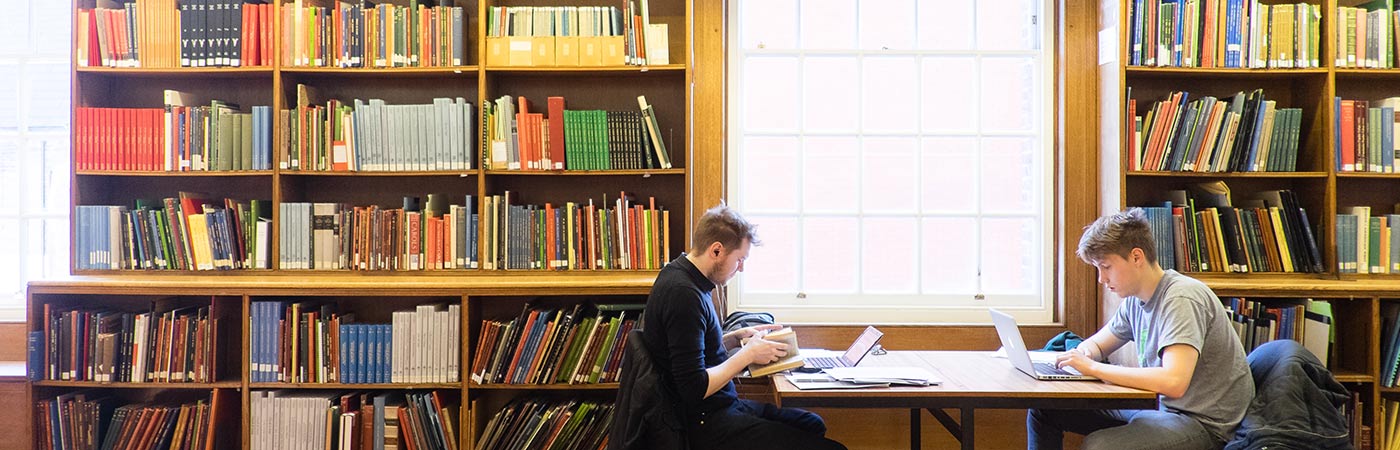 students reading in library