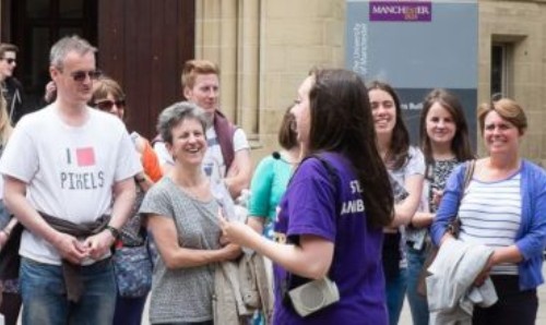 Student ambassador guides visitors at an open day at The University of Manchester.