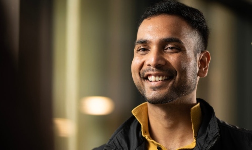 Close up of a smiling student.