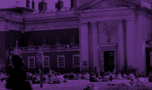 A purple-tinted image of people sitting in front of the Samuel Alexander Building.