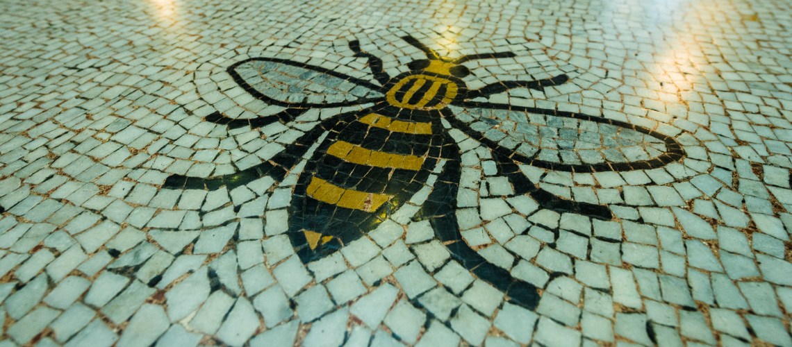 A bee mosaic on the floor