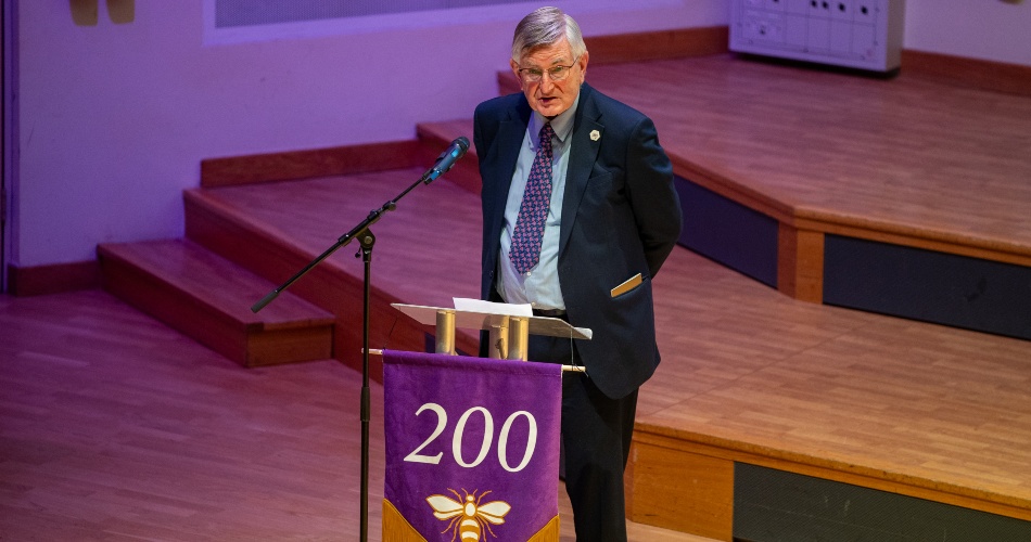 Martin Harris speaking on stage.