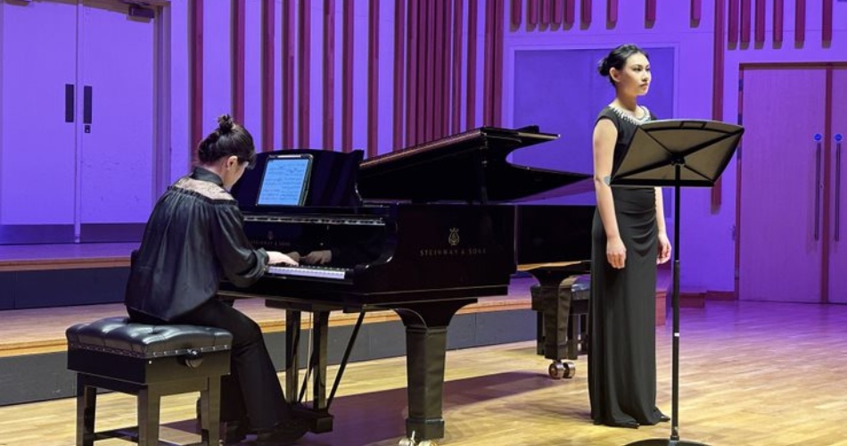 A pianist and singer perform on stage at ‘Sonic Reverie – A Chinese New Year Concert’.