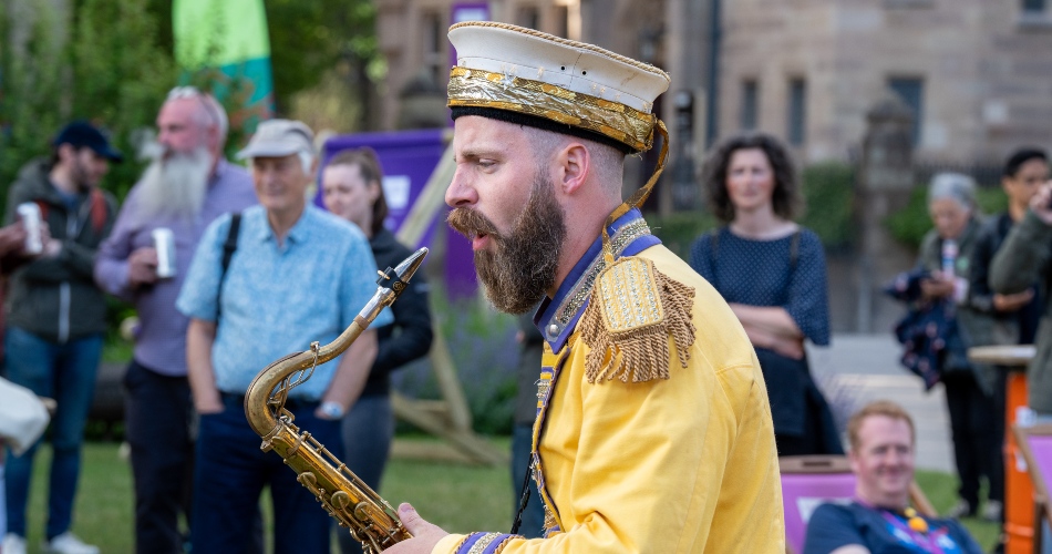 A member of Mr Wilsons Second Liners entertains the crowd.