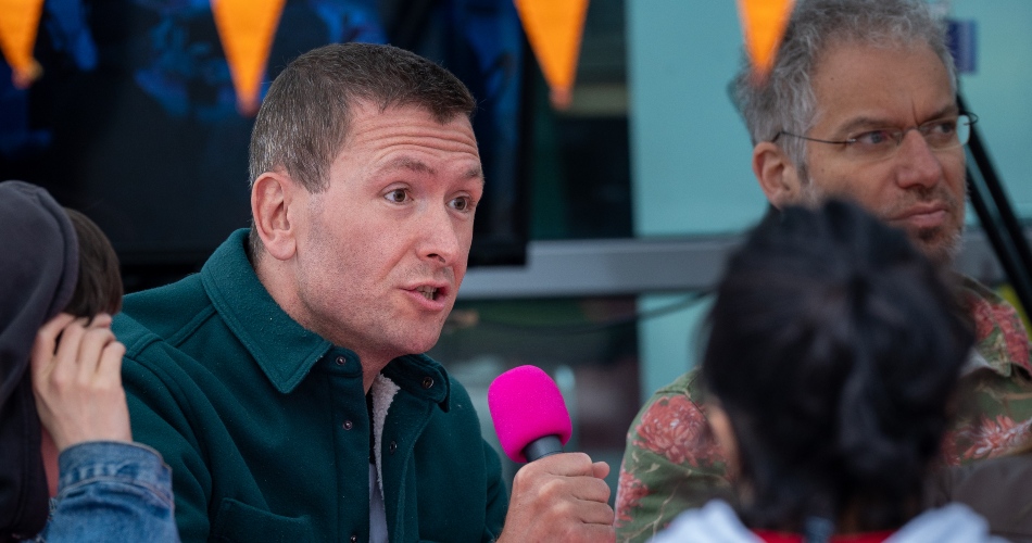 Attendees sit to take part on Talkaoke.