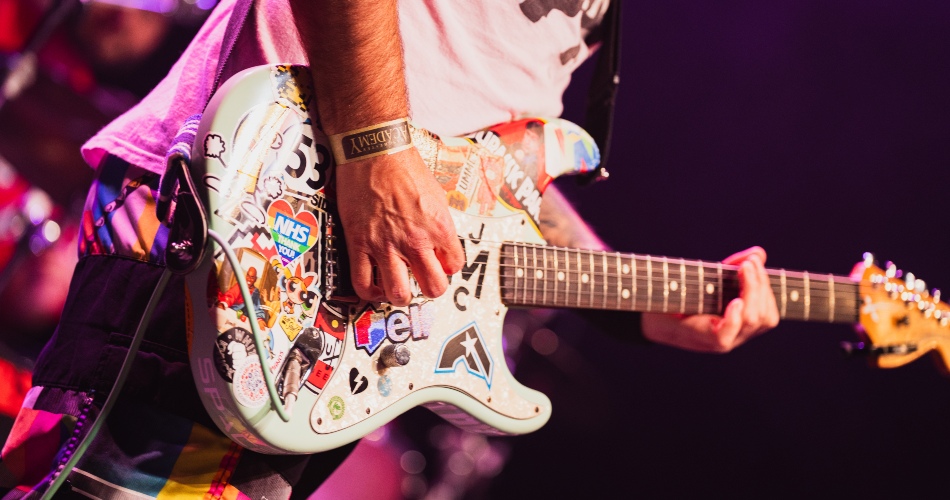 Close up of a guitar being played as part of Universally Rocks!