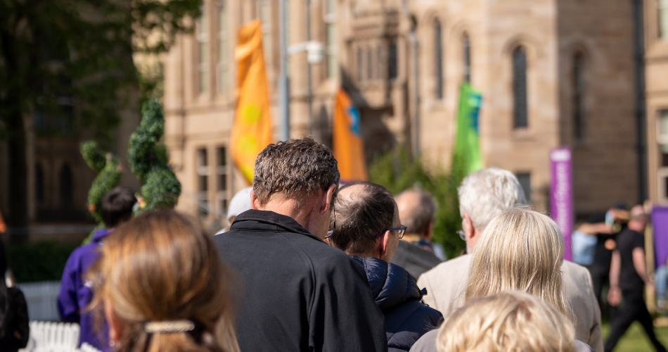 People queue up outisde the festival zone.