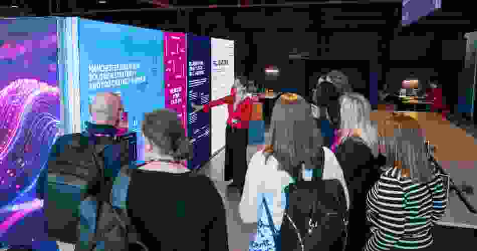 Visitors are guided through the introduction of the Ideas Lab pop-up exhibition.
