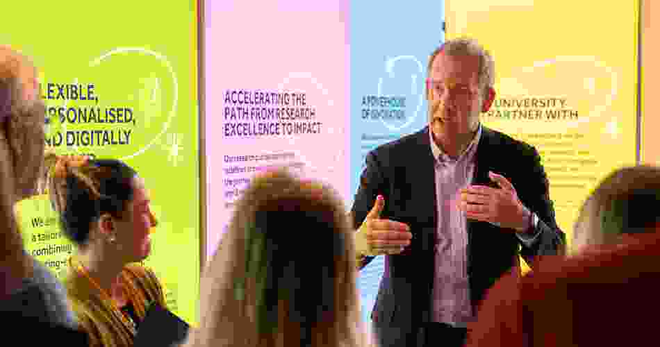 Professor Duncan Ivison talks visitors through the Ideas Lab pop-up exhibition.