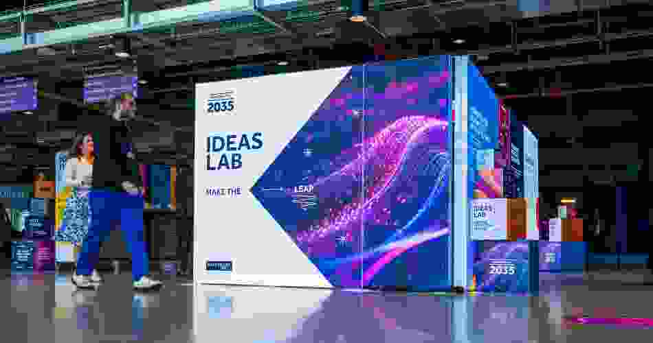 People walk by the front of the Ideas Lab pop-up exhibition.