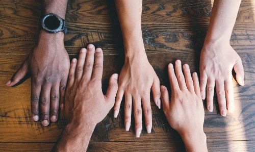Different coloured and shaped hands in a line