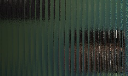 Textured glass panel with shadows behind