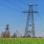 Electricity pylons in a field