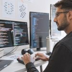 Man working on computer coding