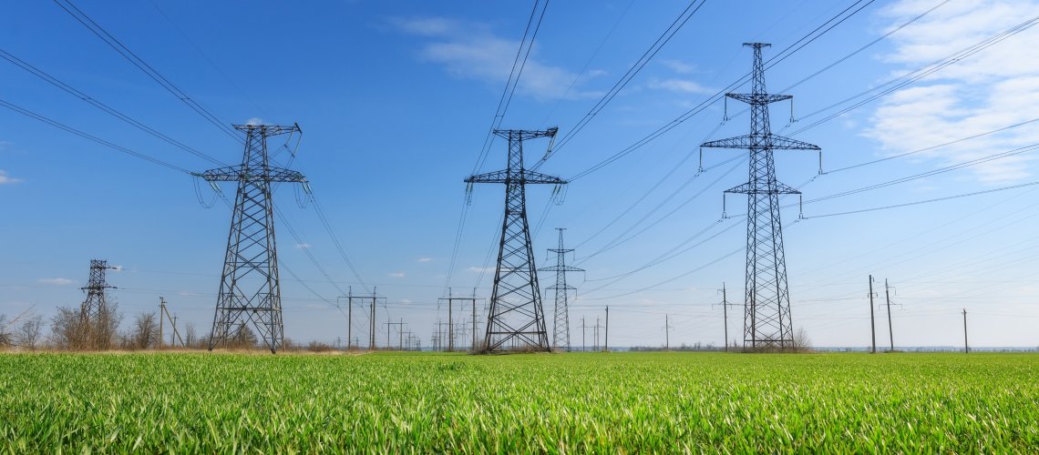Electricity pylons in a field