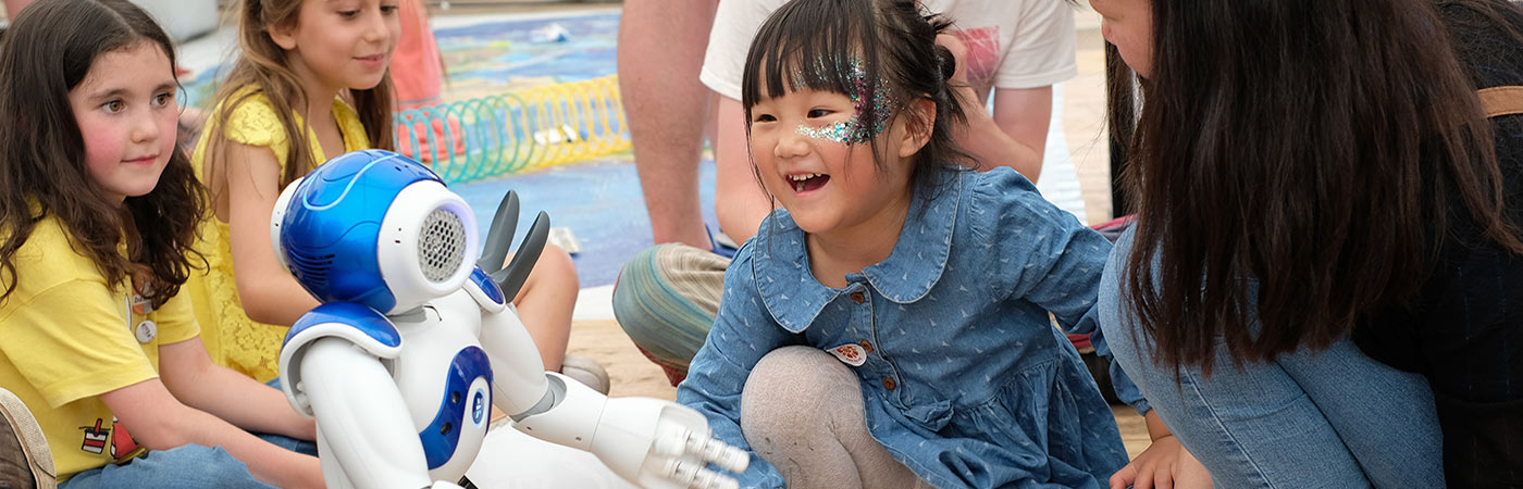 Young girl and robot at Bluedot festival