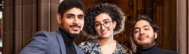 Three international students smiling