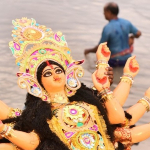 Immersion of clay idol in the Hooghly River on the last day of Durga Puja. Photo: Debapriya Charabarti, 2017.