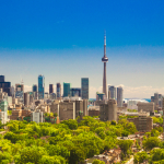 Toronto skyline with green trees in front