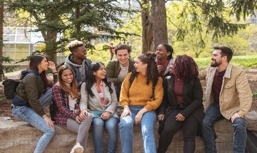 A group of students talking and laughing