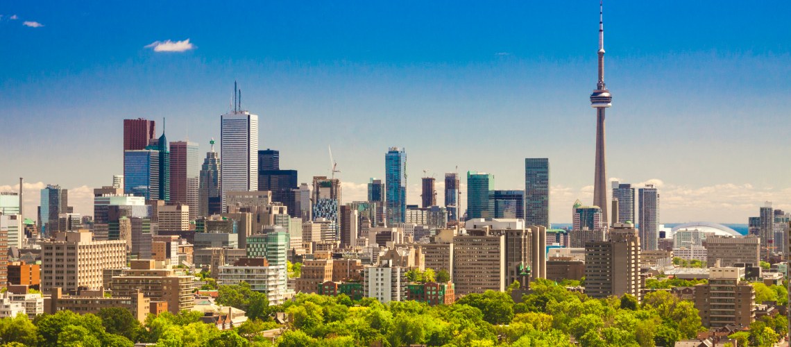 Toronto city skyline with green trees in front