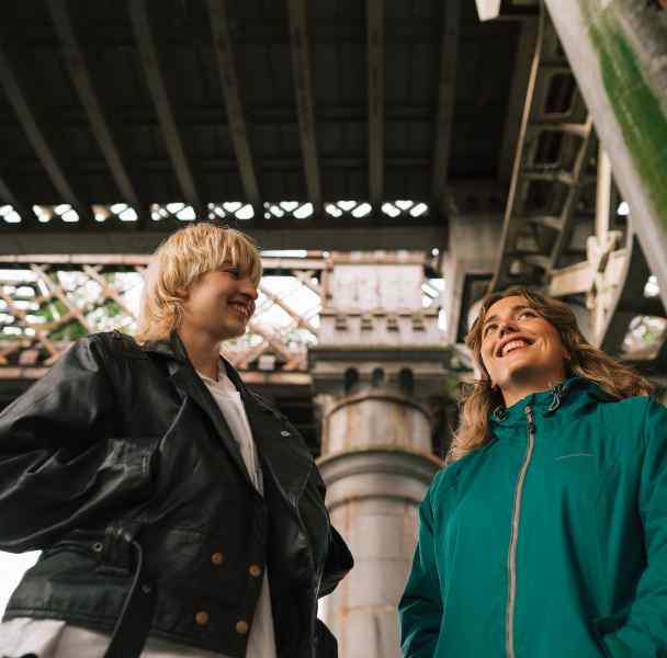 Two women under arch