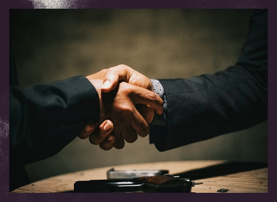 Icon of two shaking hands on a dark grainy background
