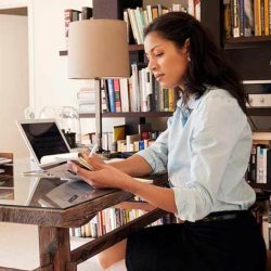 Lady working on a laptop at home