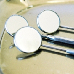 Three dental mirrors on a table