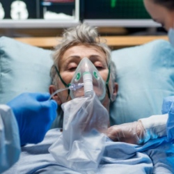 Older woman in hospital with mask