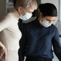 Two women working