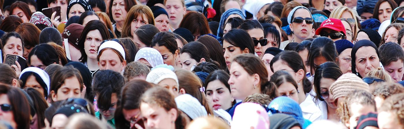 Crowd of women praying at the Western Wall in Jerusalem stock photo