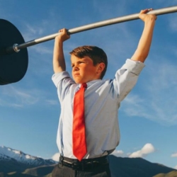 Child in suit with weights