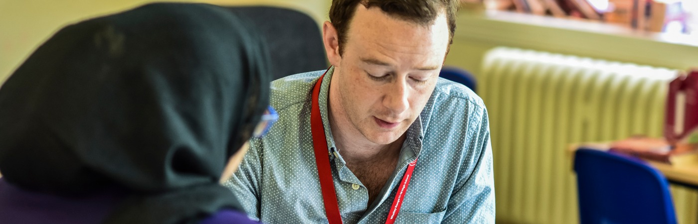 Creative Writing student advising a school pupil