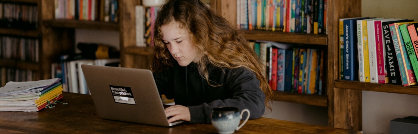 Young teen doing schoolwork at home after UK schools close due to the Coronavirus. Credit: Annie Spratt, Unsplash