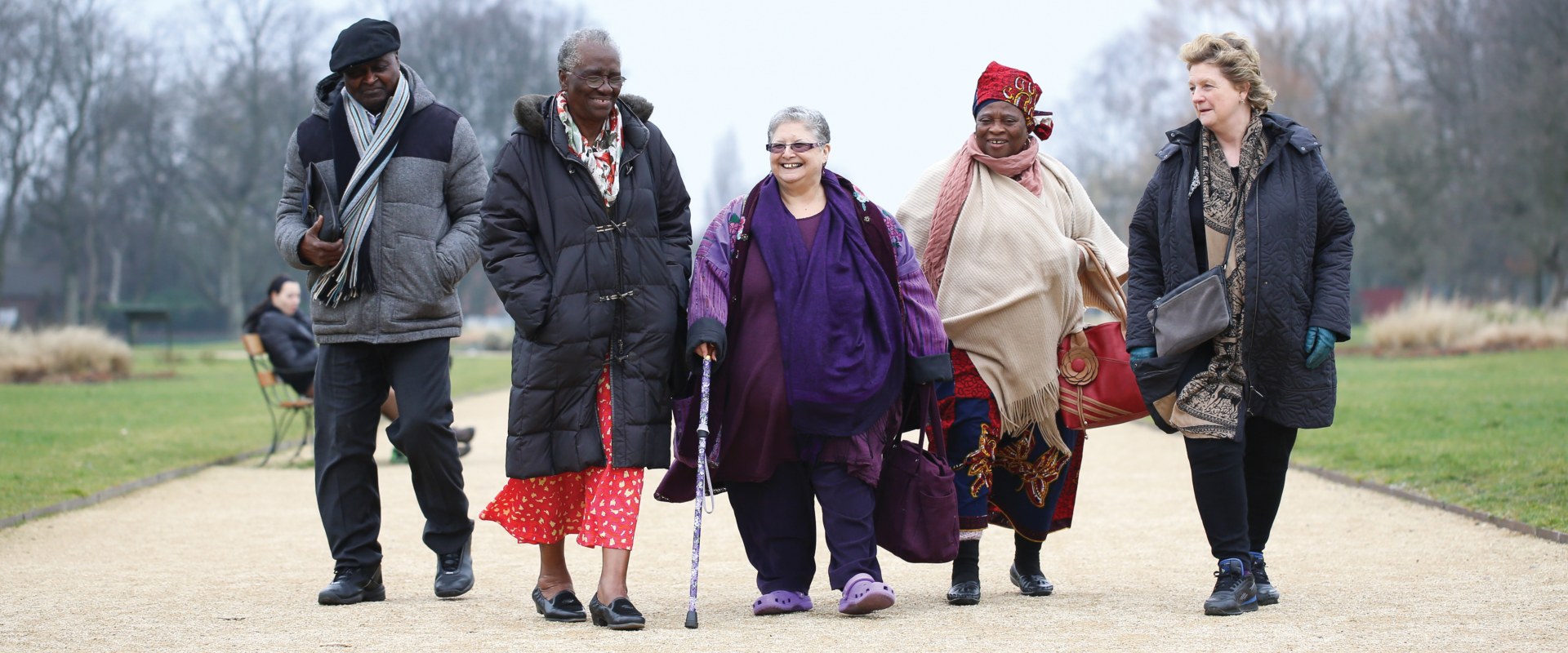 Group of elderly people walking in park