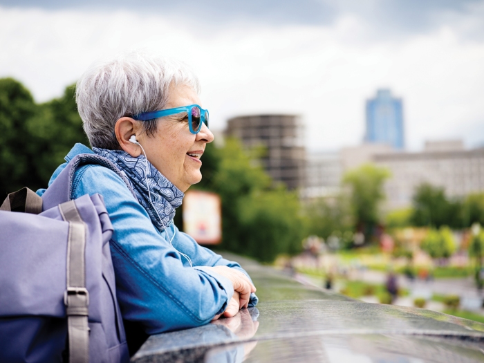 Older woman listening to music