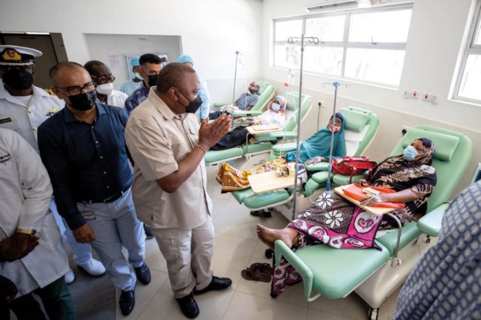 President Uhuru Kenyatta greets patients at a cancer centre in Mombasa, Kenya.