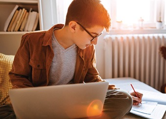 Student studying on laptop