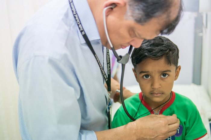 Professor Vaskar Saha treating a patient