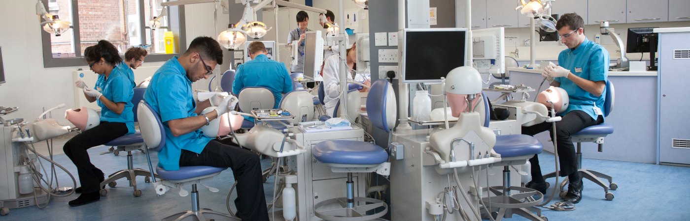 Dentistry students learning on machines