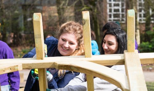 Two University of Manchester students volunteering at Whitworth Park.