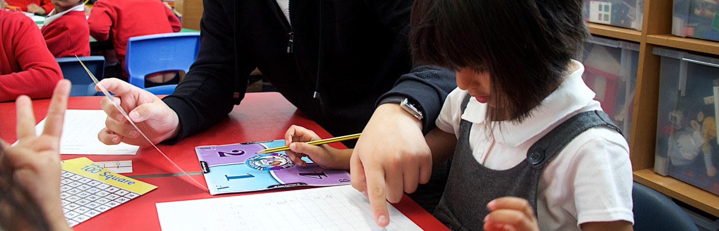 A close up of a school child working