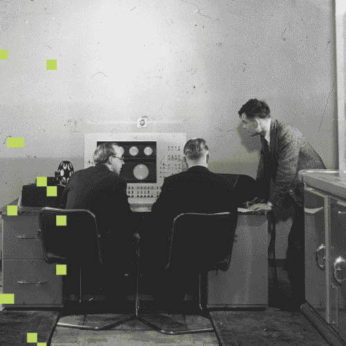Three men work at the console of the Ferranti Mk I