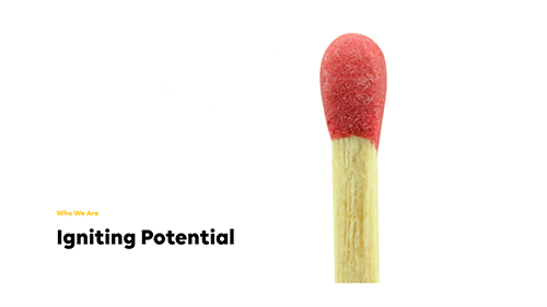 University of Manchester arched entrance with gothic architecture and stained-glass windows.