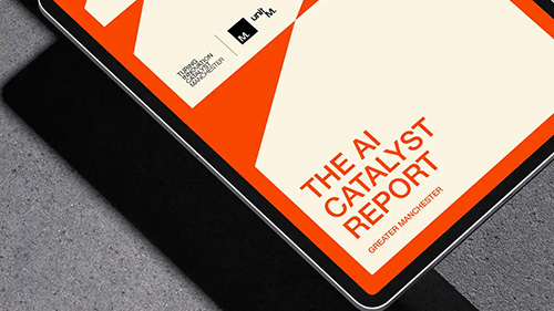 MediaCityUK buildings and bridge reflected in water at sunset with vibrant sky in Salford Quays.