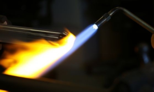 Flame heating up metal rod