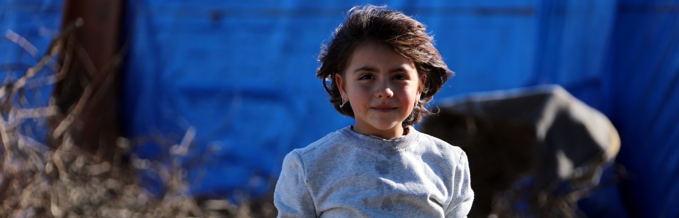little girl in refugee camp