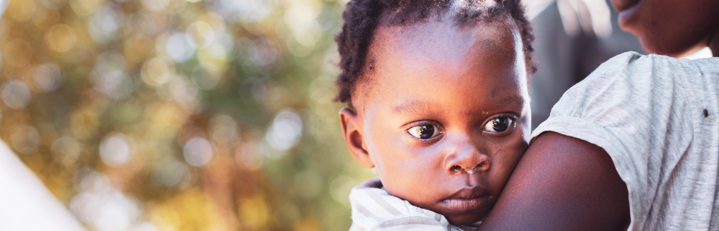 Woman carrying her baby in Africa