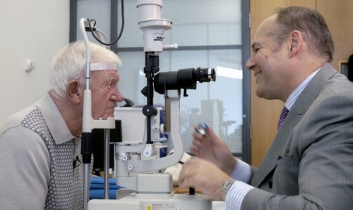 Professor Paulo Stanga with 'bionic eye' patient Keith Hayman